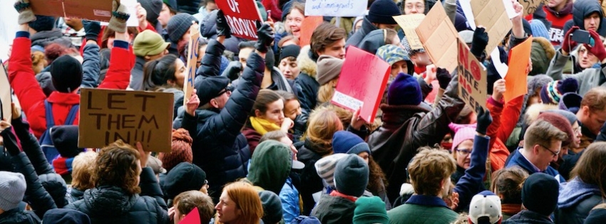 demonstrators holding signs