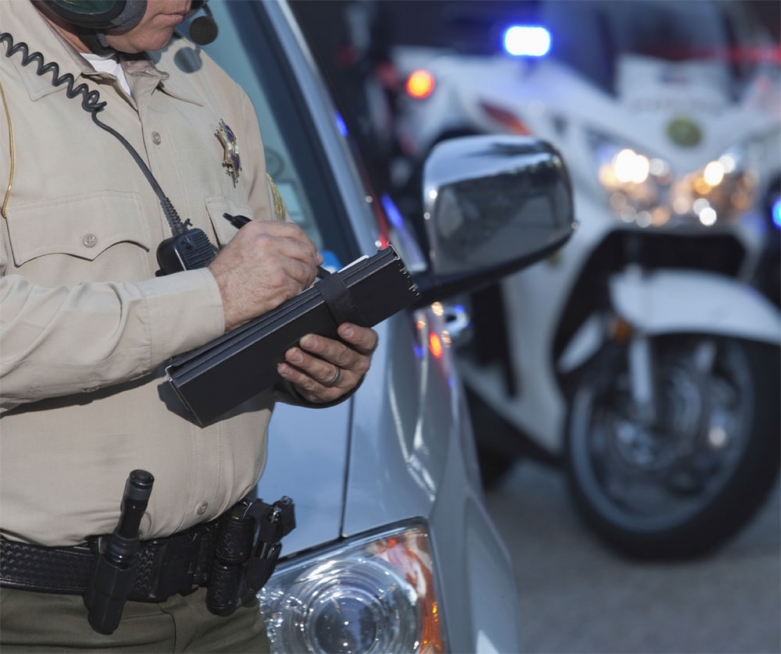 police officer writing a ticket