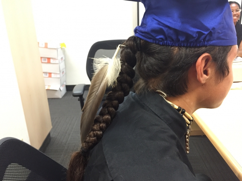 Eagle feather with graduation cap