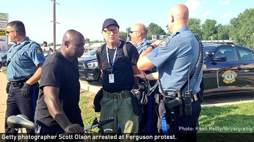 Getty photographer Scott Olson arrested at Ferguson protest.