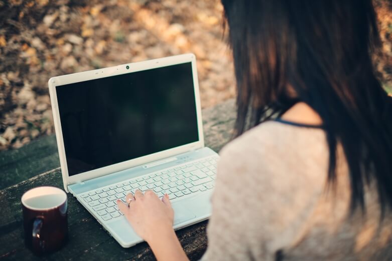 Person on laptop via Shutterstock