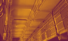 interior of a jail with light orange and dark burgandy overlaid