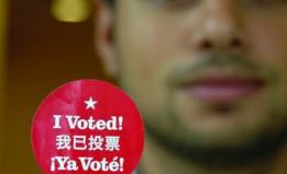 Individual holding vote sticker