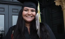 Native student wearing eagle feather