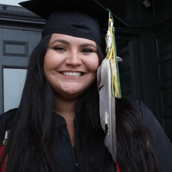 Native student wearing eagle feather